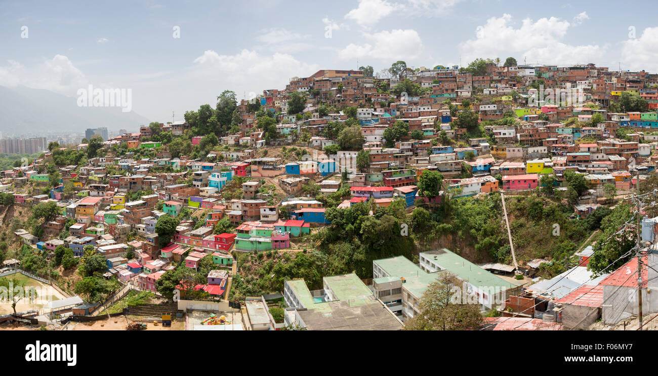 Small wooden coloured houses in the poor neighborhood in Caracas. It cover the hills around Caracas and it is dangerous Stock Photo