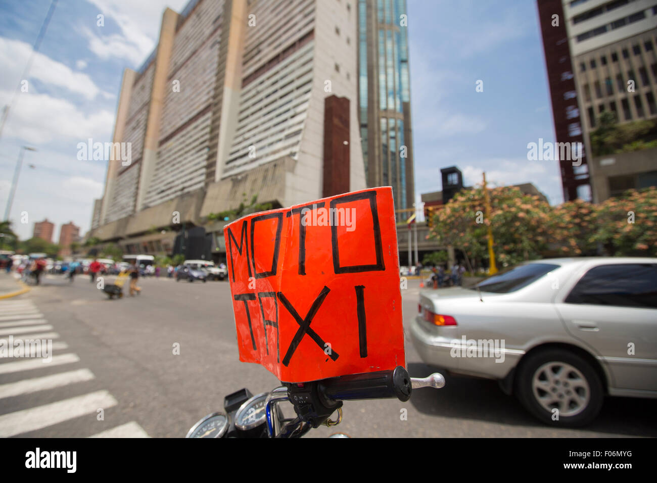Moto taxi sign standing on a motorbike in downtown Caracas where they are the worst plague. Venezuela 2015 Stock Photo