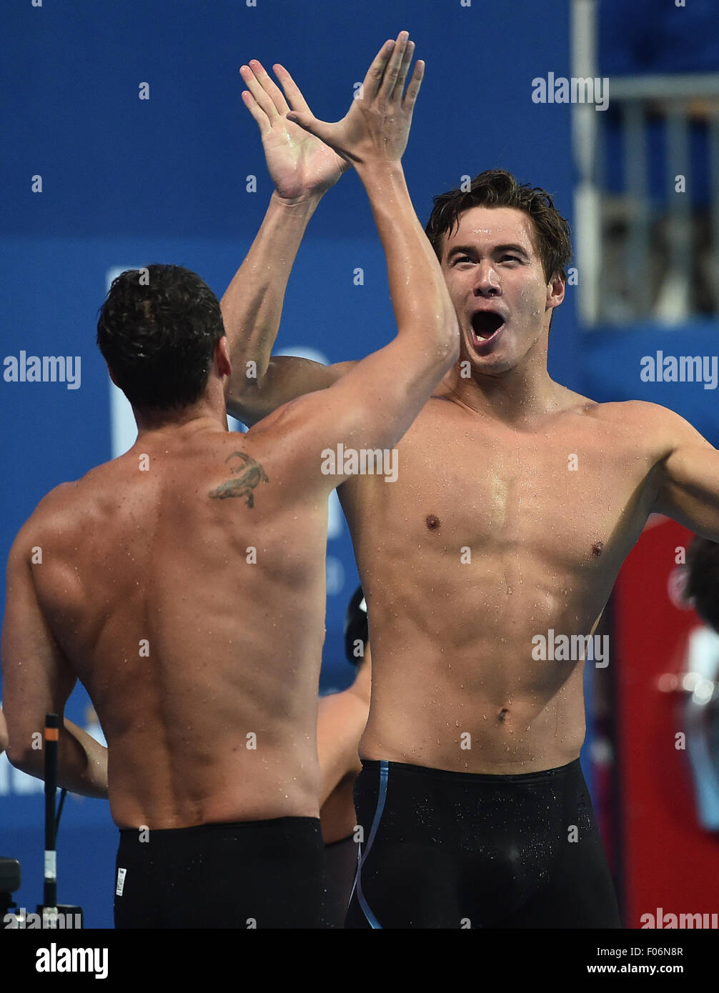 Kazan, Russia. 8th Aug, 2015. Nathan Adrian (R) and Ryan Lochte of the relay team of the United States celebrate after the mixed 4x100m freestyle relay final at FINA World Championships in Kazan, Russia, Aug. 8, 2015. The United States claimed the title and broke the world record in a time of 3 minutes 23.05 seconds. © Dai Tianfang/Xinhua/Alamy Live News Stock Photo