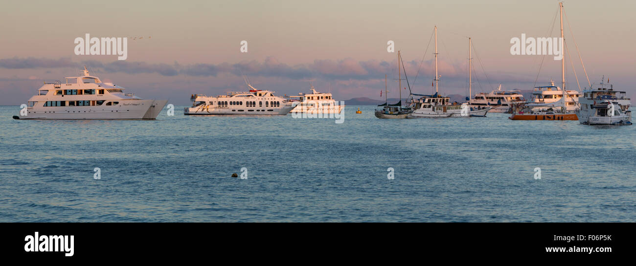 Sunset and cruise ships in the port of Puerto Ayora. Galapagos Islands, Ecuador on February 15, 2015 Stock Photo
