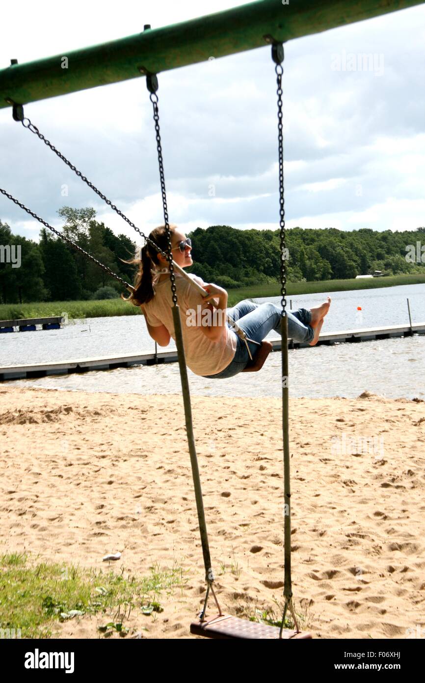 Woman on a swing hi-res stock photography and images - Alamy