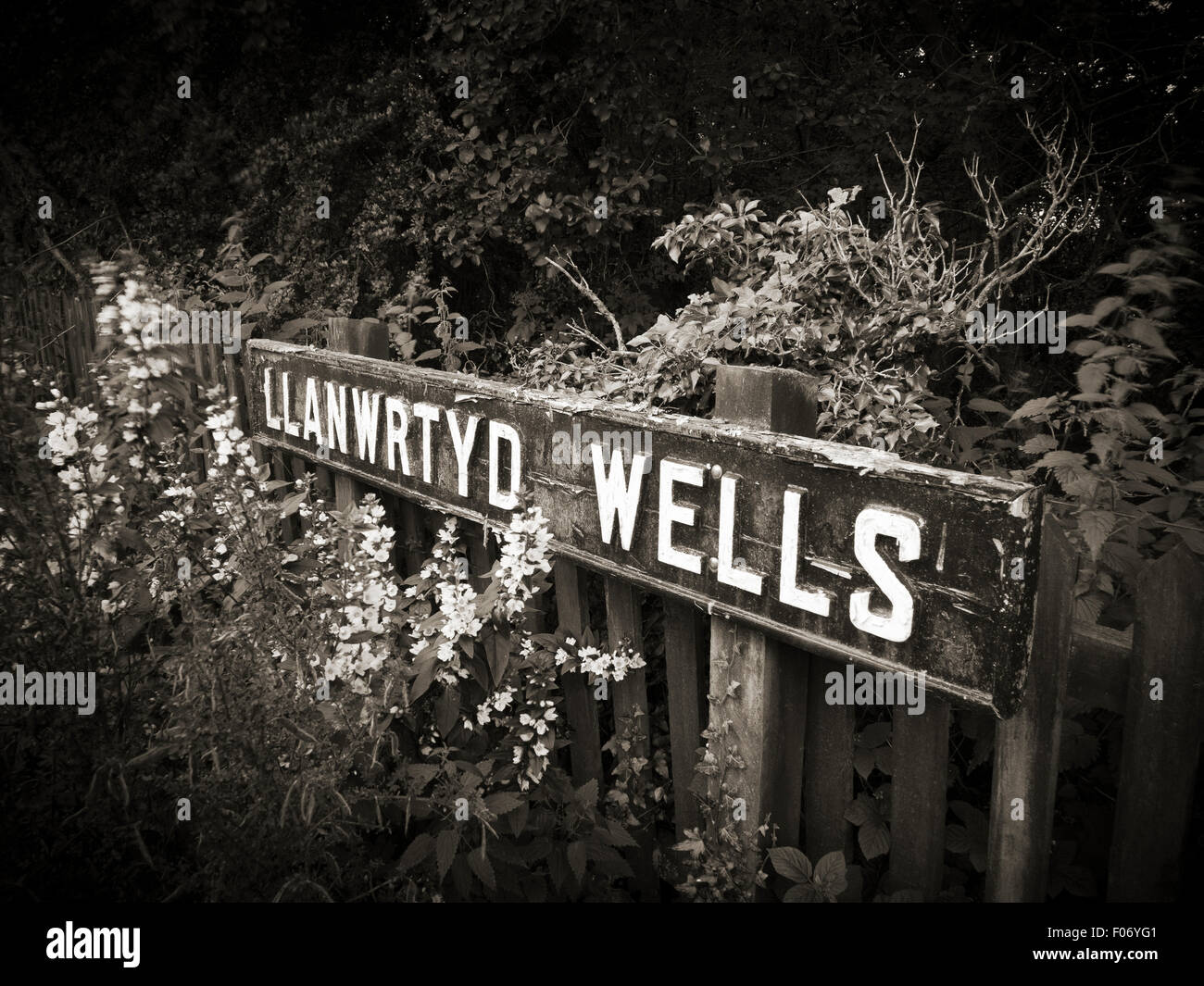 Sepia shot of the old station name sign at the Railway Station at Llanwrtyd Wells, Powys, Mid Wales Stock Photo