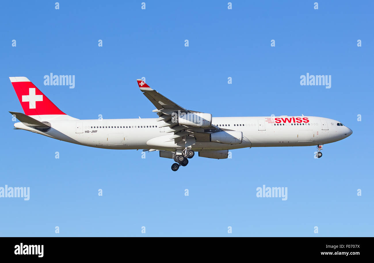 ZURICH - JULY 18: Airbus A340 Swiss landing in Zurich after short haul flight on July 18, 2015 in Zurich, Switzerland. Zurich ai Stock Photo