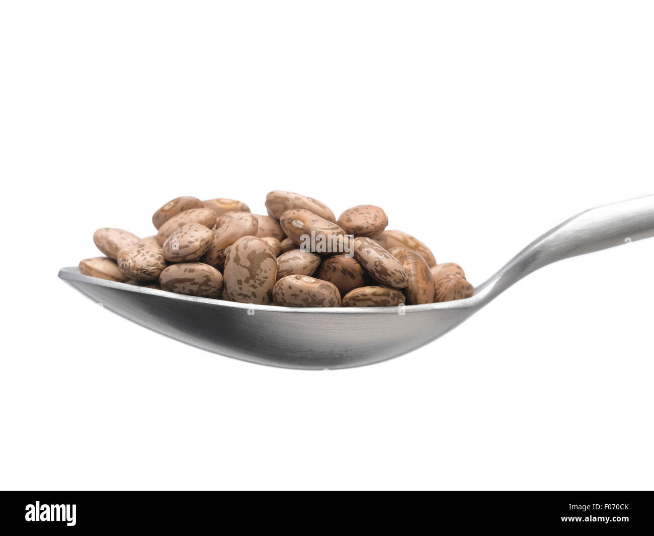 Pinto Beans isolated on spoon Stock Photo