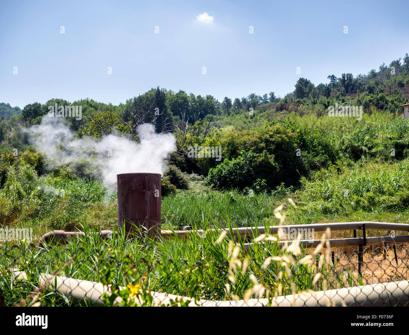 Geothermal smoke pipes fumes in Sasso Pisano, Tuscany - Italy Stock Photo