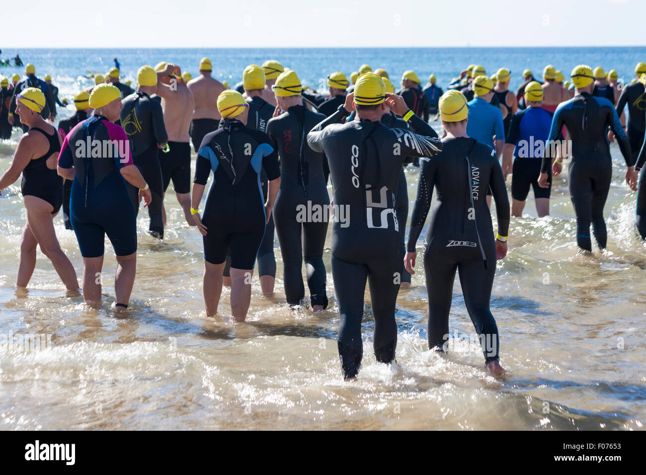 Bournemouth, UK 9 August 2015. British Heart Foundation Bournemouth Pier to Pier Swim, the biggest charity swim in Europe as supporters brave the English Channel in this 1.4 mile open water swim, starting from Bournemouth Pier swimmers are put to the test in this challenging sea swim along the coastline to Boscombe Pier. The event was rescheduled from July due to adverse weather conditions and takes place on a hot sunny day Credit:  Carolyn Jenkins/Alamy Live News Stock Photo