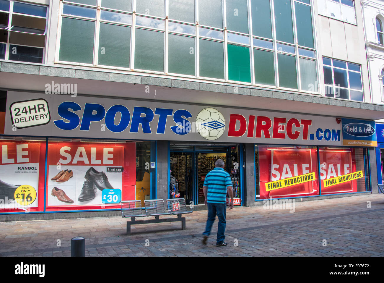 Man walking in to Sports direct shop on high street Wolverhampton West