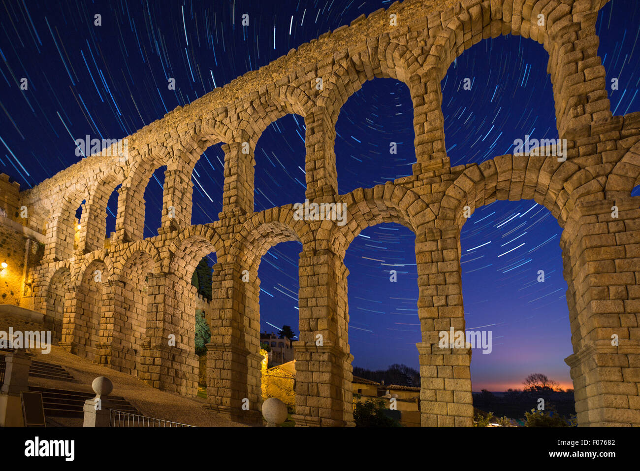 Astronomy - Star Trails and the Roman Aqueduct in the city of Segovia in the Castila and Leon region of central Spain. Stock Photo