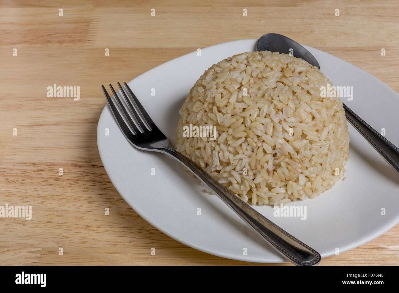 Cooked Jasmine Brown Rice in Plate Stock Photo - Alamy