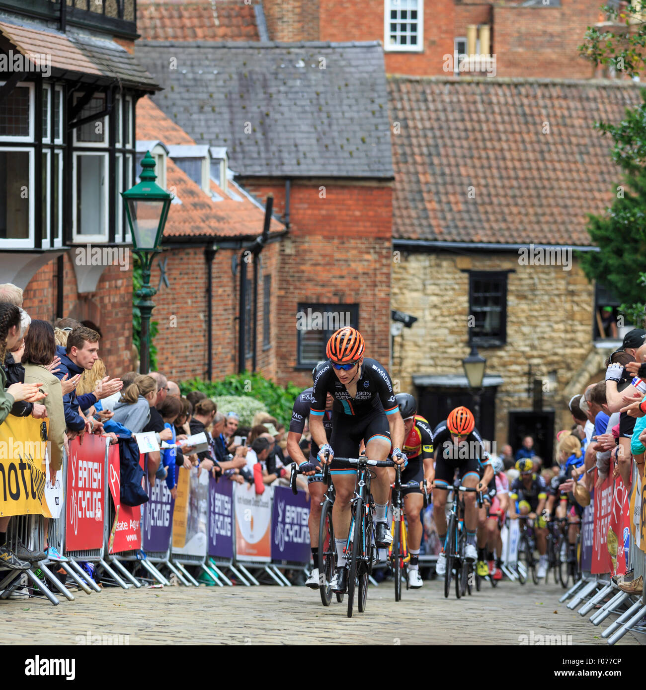 The peloton crest the cobbled climb of Michaelgate and Wordsworth Street during the British National Championships 2015, Lincoln Stock Photo