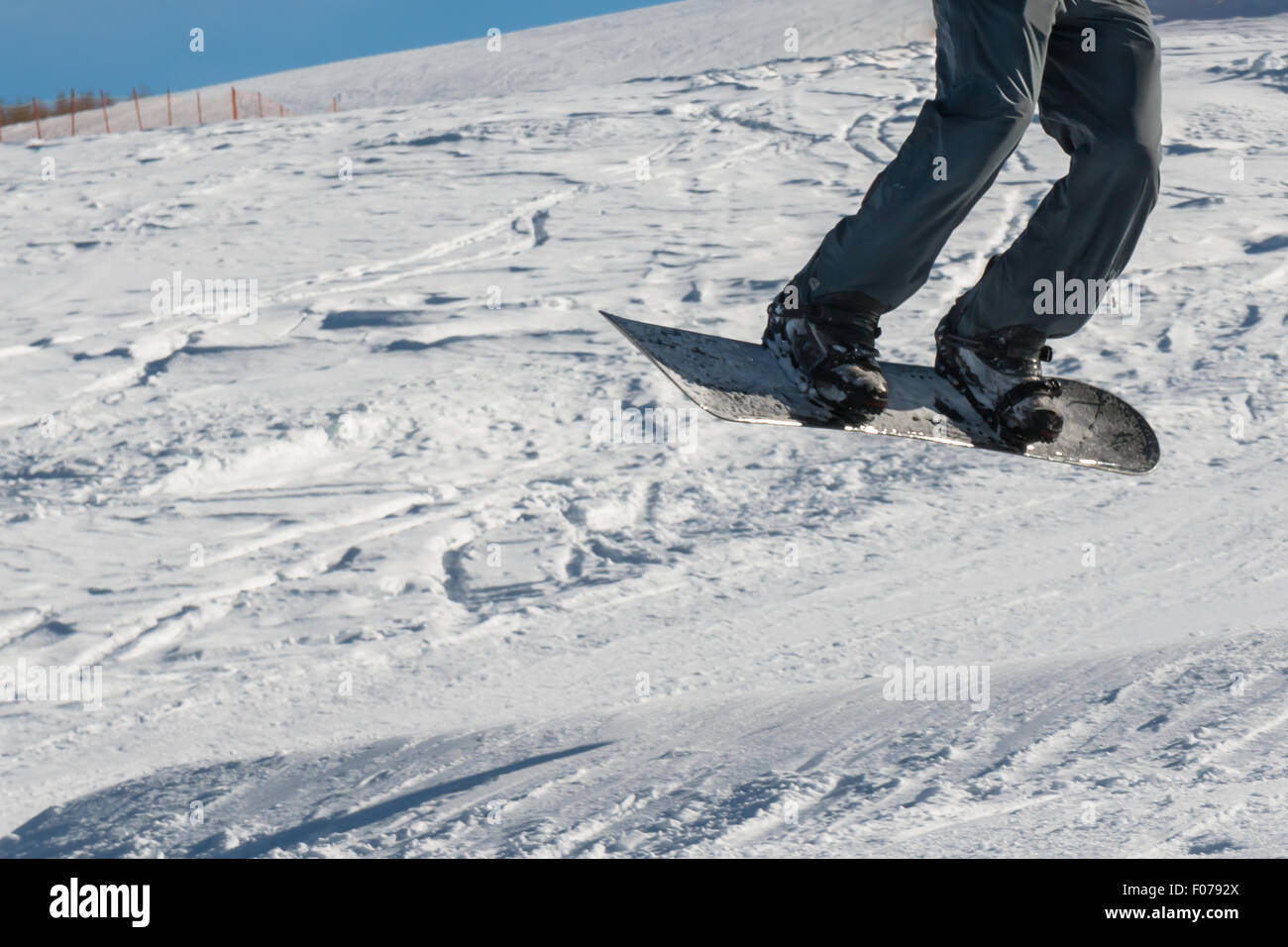 closeup of freestyle snowboarder jump Stock Photo