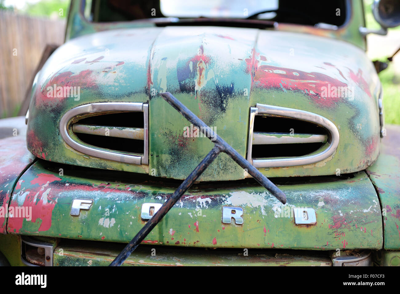 An old Ford Truck sits in a junkyard in America awaiting it's fate