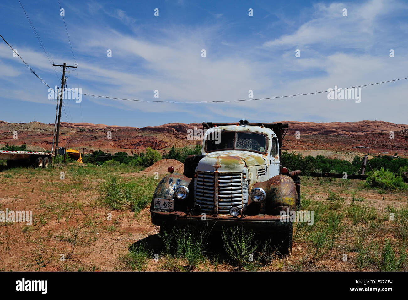 A 1950's International Harvester (IH) truck sits abandoned in a field. Stock Photo