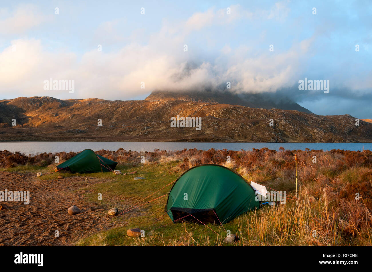 Suilven at sunset from a wild camp on the south shore of Fionn Loch, Inverpolly Forest, Sutherland, Scotland, UK Stock Photo