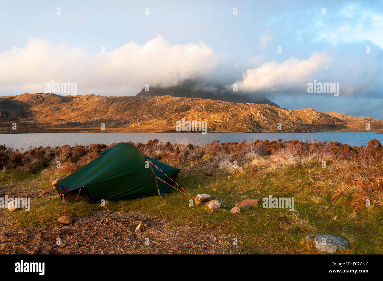 Suilven at sunset from a wild camp on the south shore of Fionn Loch, Inverpolly Forest, Sutherland, Scotland, UK Stock Photo
