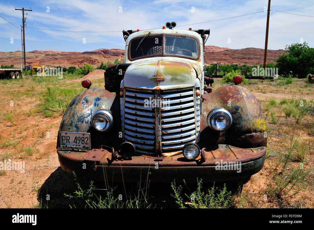 A 1950's International Harvester (IH) truck sits abandoned in a field. Stock Photo