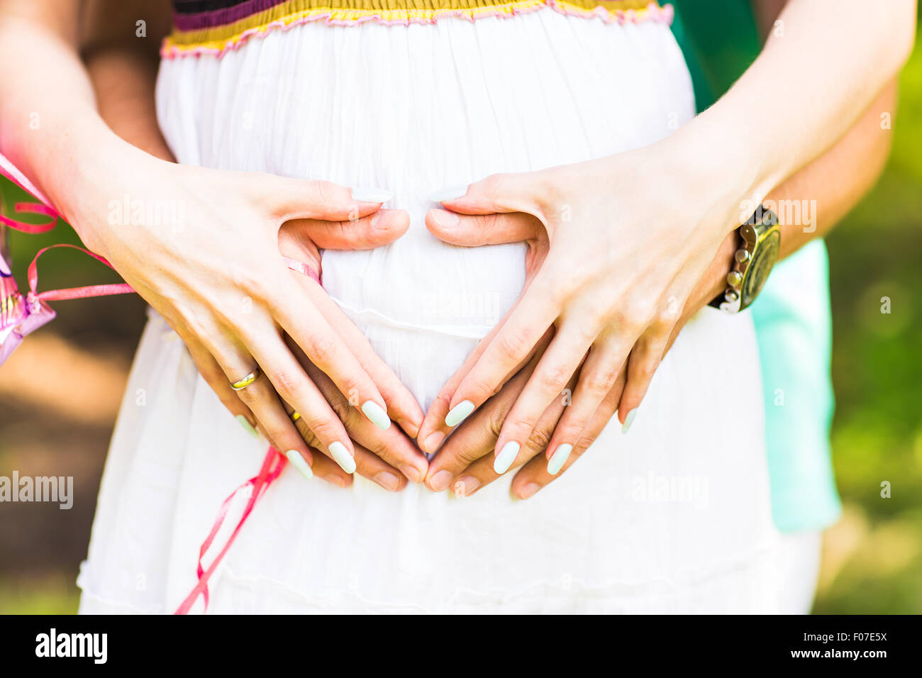 pregnant woman and her husband in the park Stock Photo - Alamy