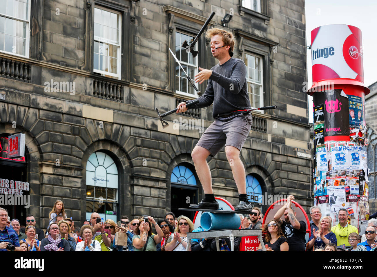Daniel Zindler from Canada performing a juggling and balancing act in the Royal Mile, Edinburgh during the Edinburgh Fringe Fest Stock Photo