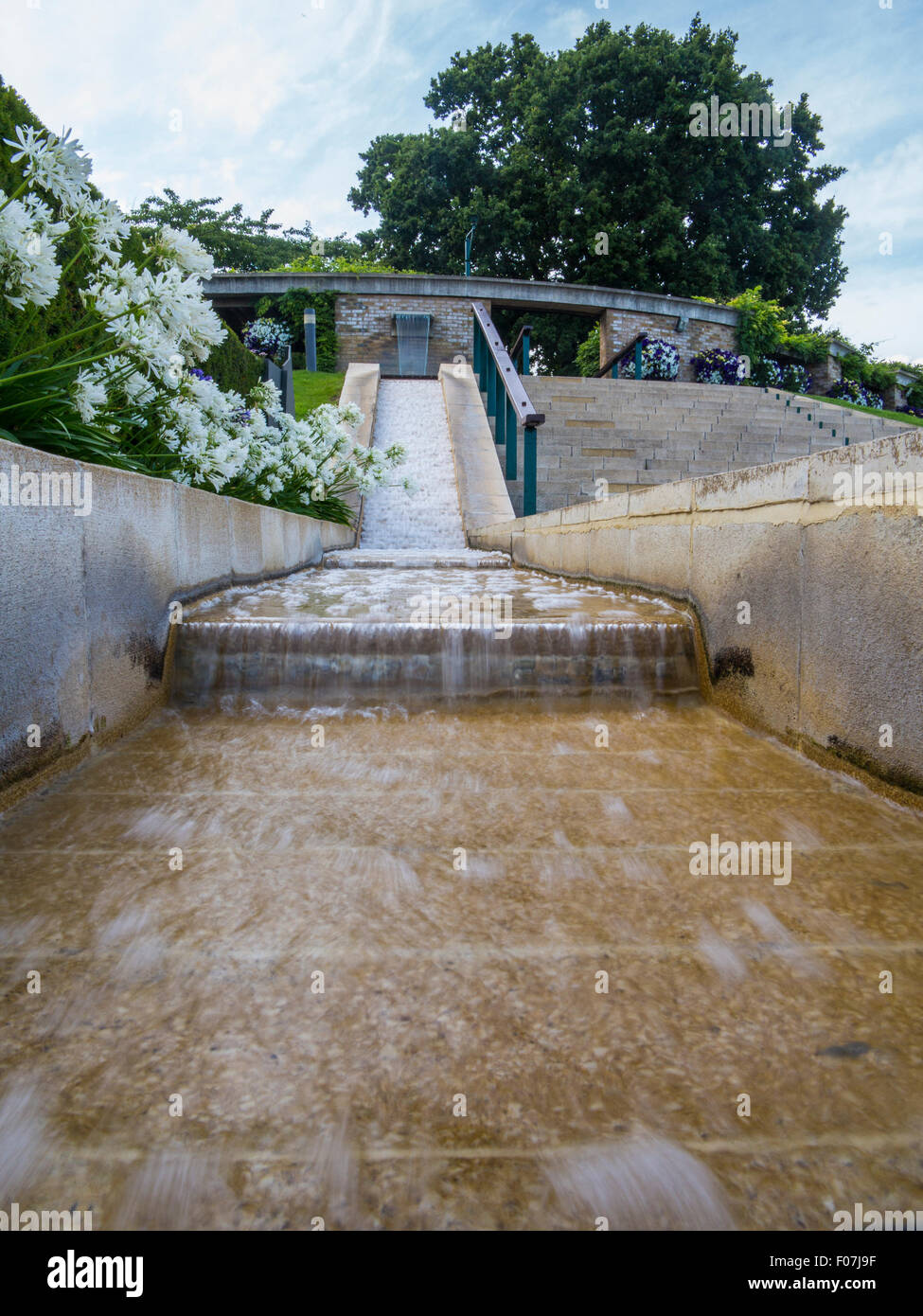 A fountain and waterfall water feature at the All England Tennis Club, Wimbledon, home of the