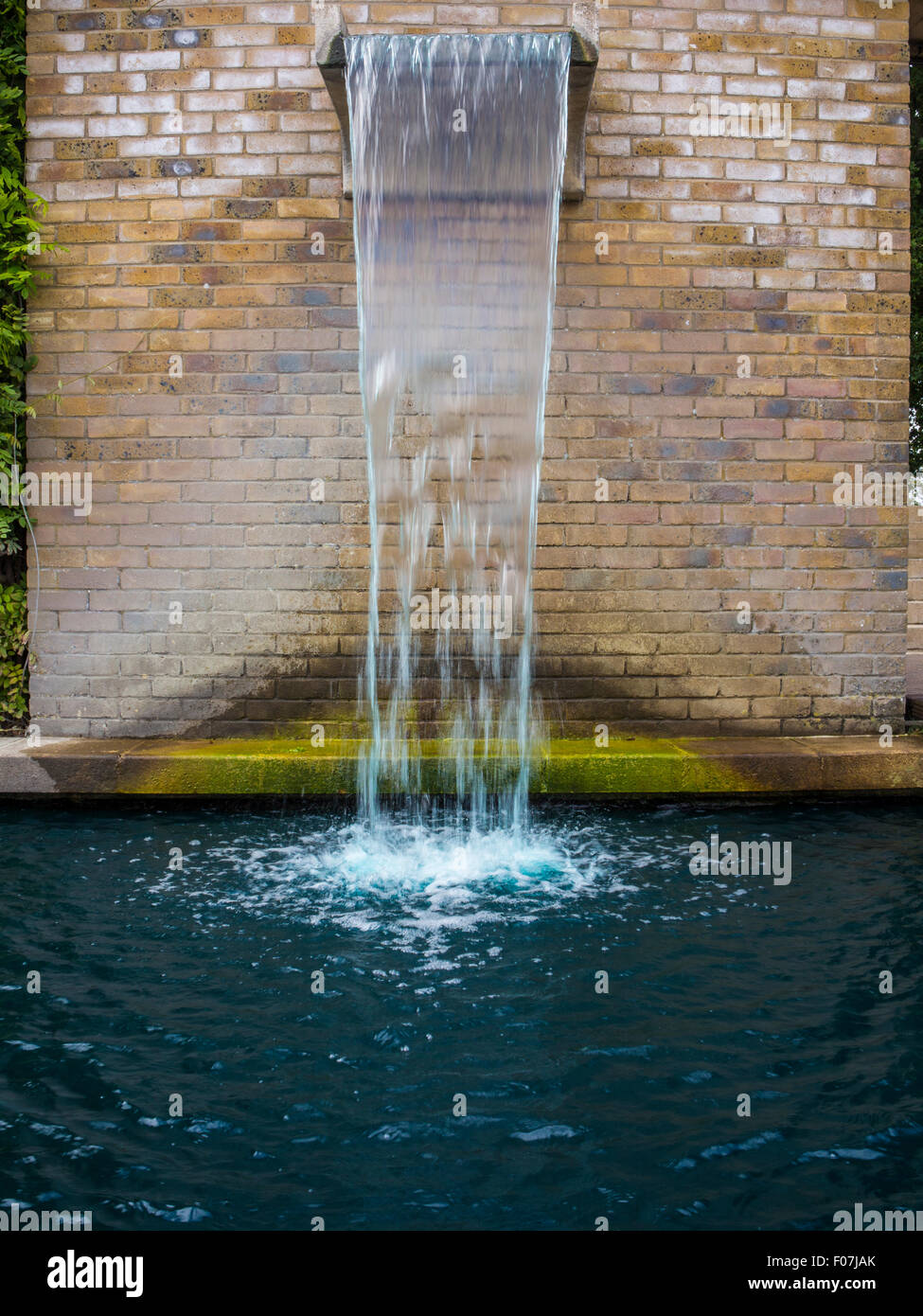A fountain and waterfall water feature at the All England Tennis Club, Wimbledon, home of the