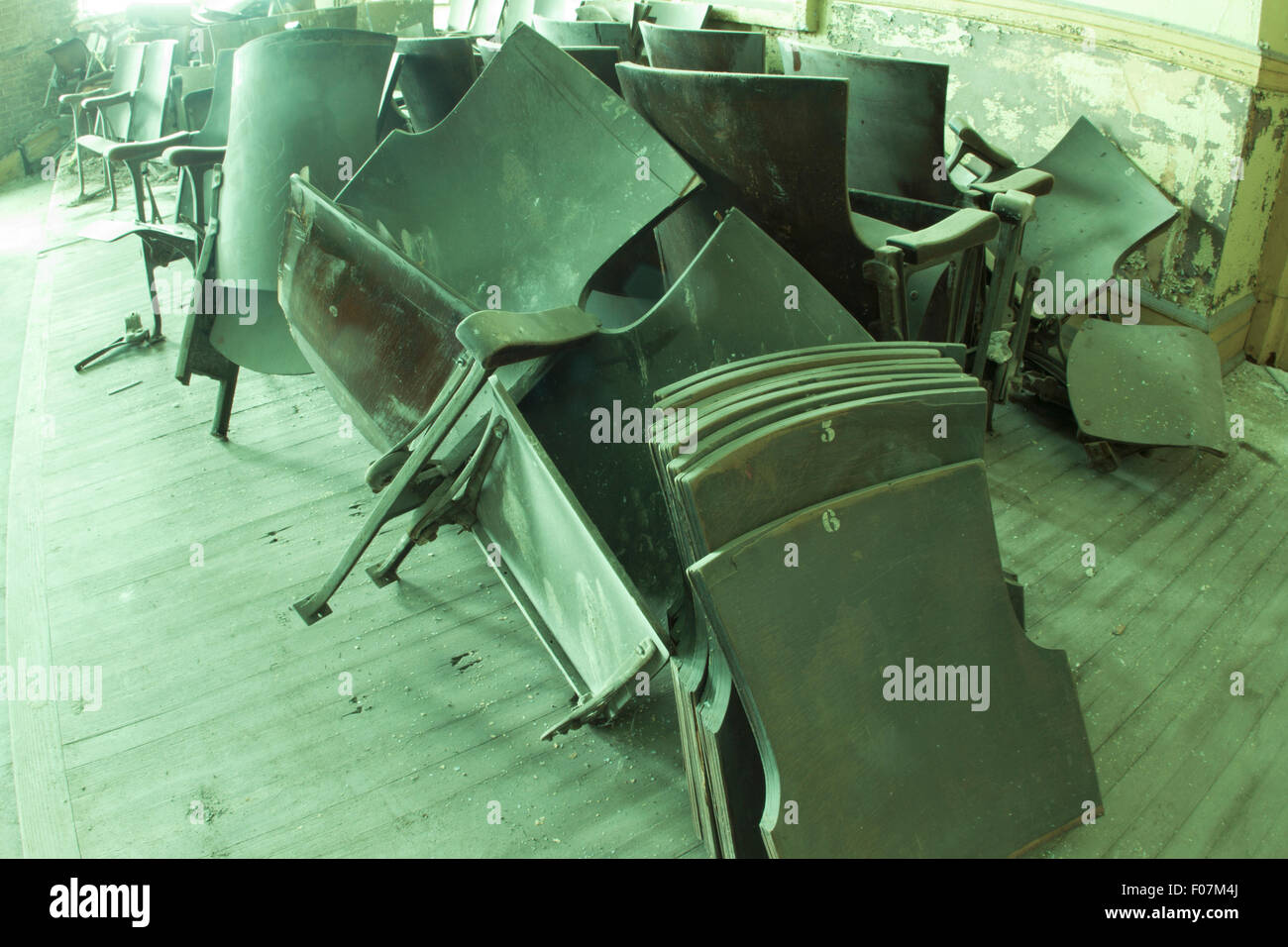 Broken theater seats in old school auditorium, Stock Photo