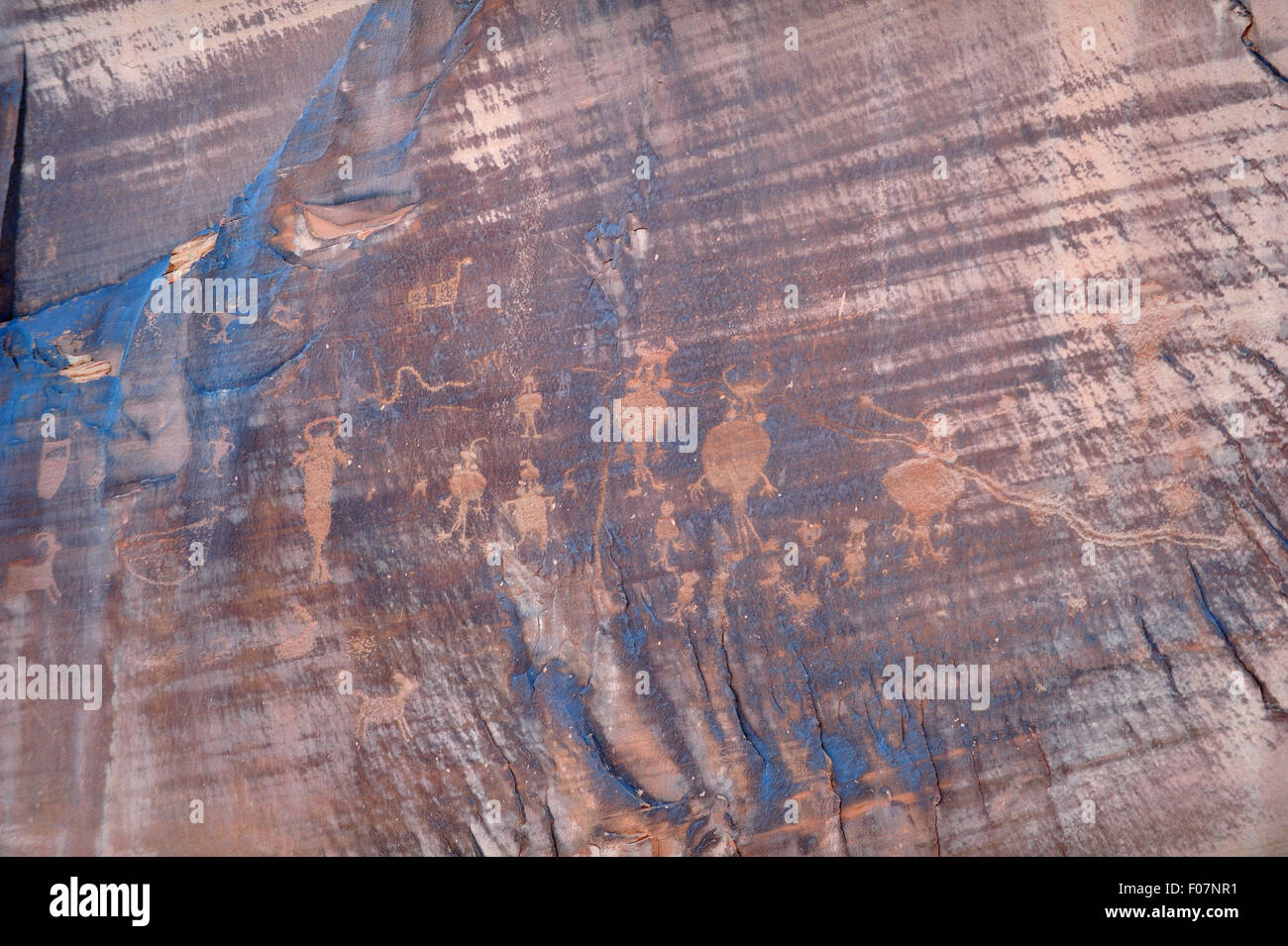 Ancient Indian pettroglyphs on the rock walls along the Colorad River in Moab, Utah; United States. Stock Photo