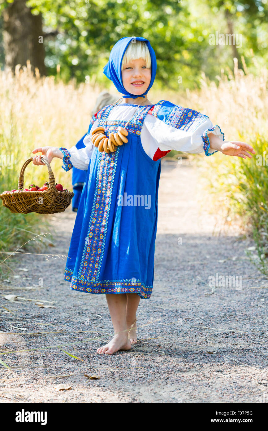 Russian children in traditional Russian costumes playing in the forest  Stock Photo - Alamy