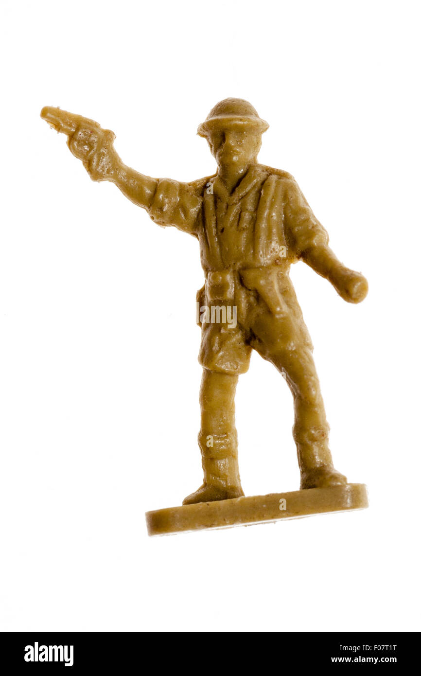 Airfix HO/OO plastic model toy soldier figure. World War Two, 8th army soldier figure. Officer standing firing pistol into air. Plain white background. Stock Photo