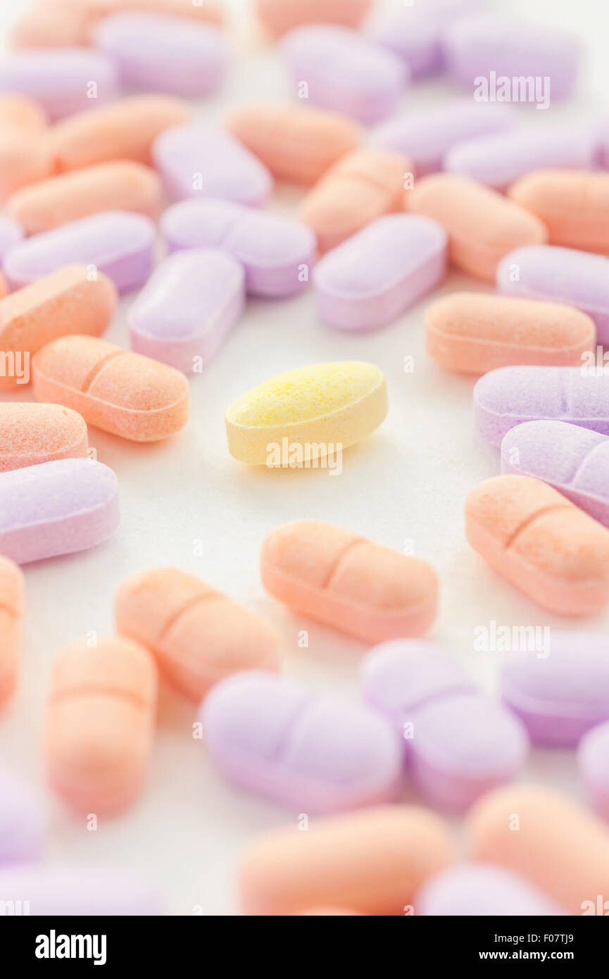 Vitamin spilling on a white background, Selective focus Stock Photo