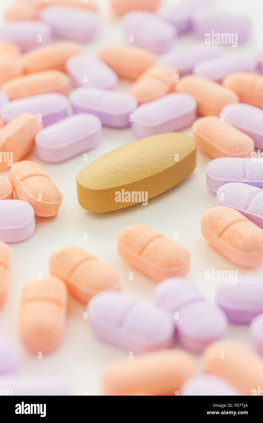 Vitamin spilling on a white background, Selective focus Stock Photo