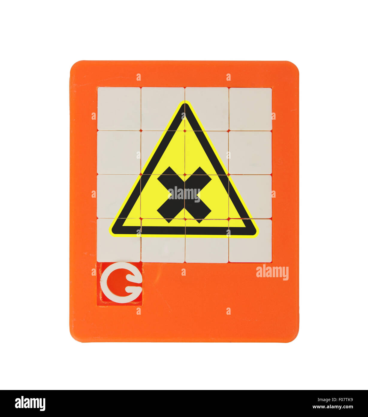 Old puzzle slide game, isolated on white - irritating (danger) symbol Stock Photo