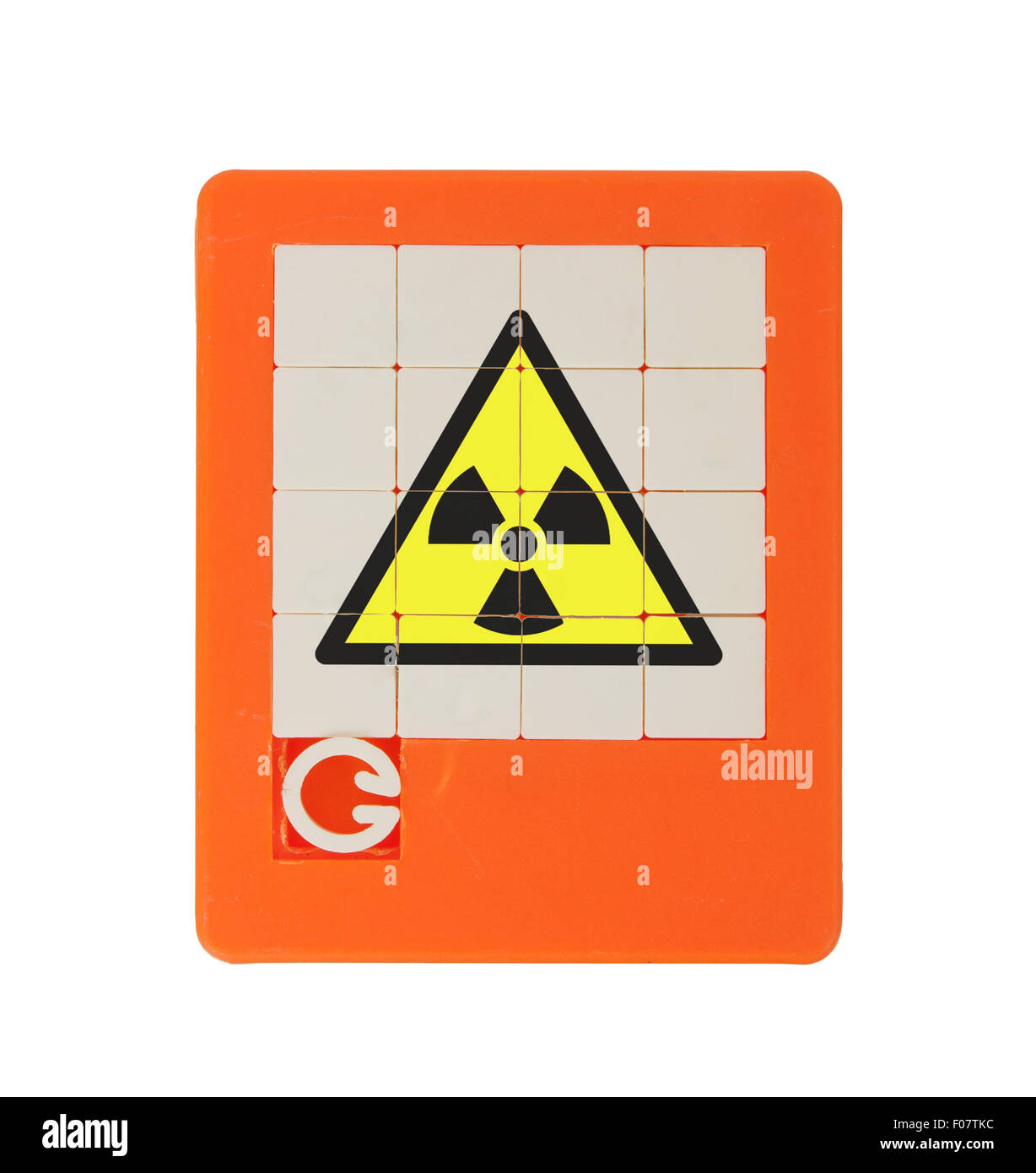 Old puzzle slide game, isolated on white - radiation (danger) symbol Stock Photo