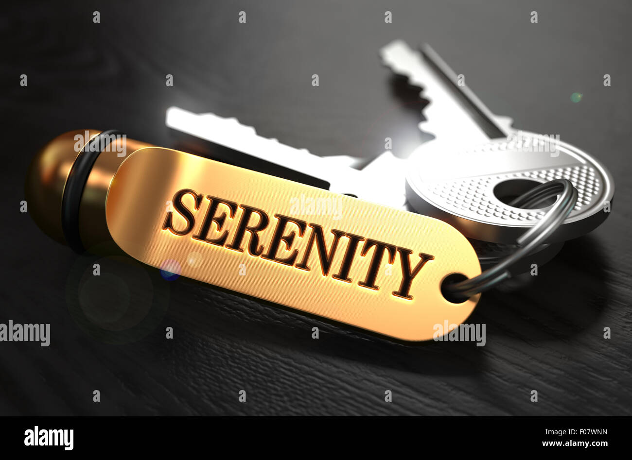 Keys with Word Serenity on Golden Label. Stock Photo
