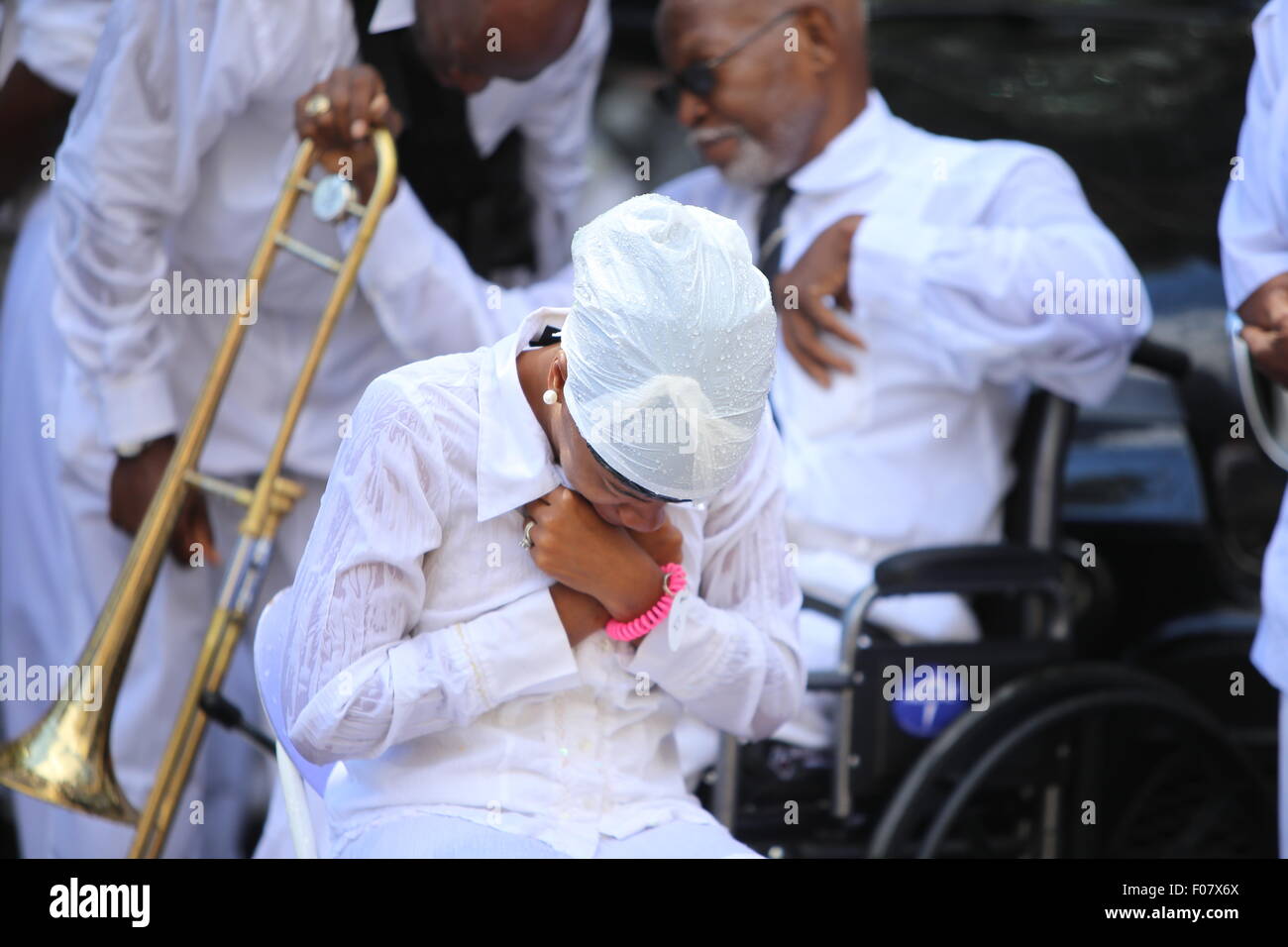 New York City, United States. 09th Aug, 2015. Female congregant passionate during street baptism. The United House of Prayer for All People staged its annual street baptism in Harlem. Credit:  Andy Katz/Pacific Press/Alamy Live News Stock Photo