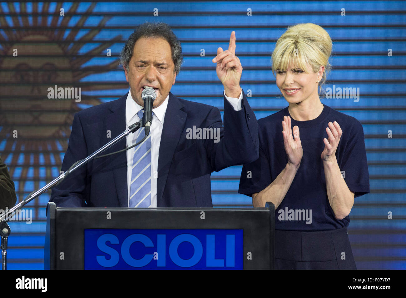 Buenos Aires, Argintina. 10th Aug, 2015. The presidential candidate to Argentina's Presidency of ruling party "Frente para la Victoria" (Front for Victory), Daniel Scioli (L), speaks along with his wife Karina Rabolini (R), at the campaign bunker, in Buenos Aires city, Argentina, early Aug 10, 2015. Scioli received most votes in the national primary elections in Buenos Aires on Sunday, ahead the general elections to be held on October 25th. Credit:  Xinhua/Alamy Live News Stock Photo
