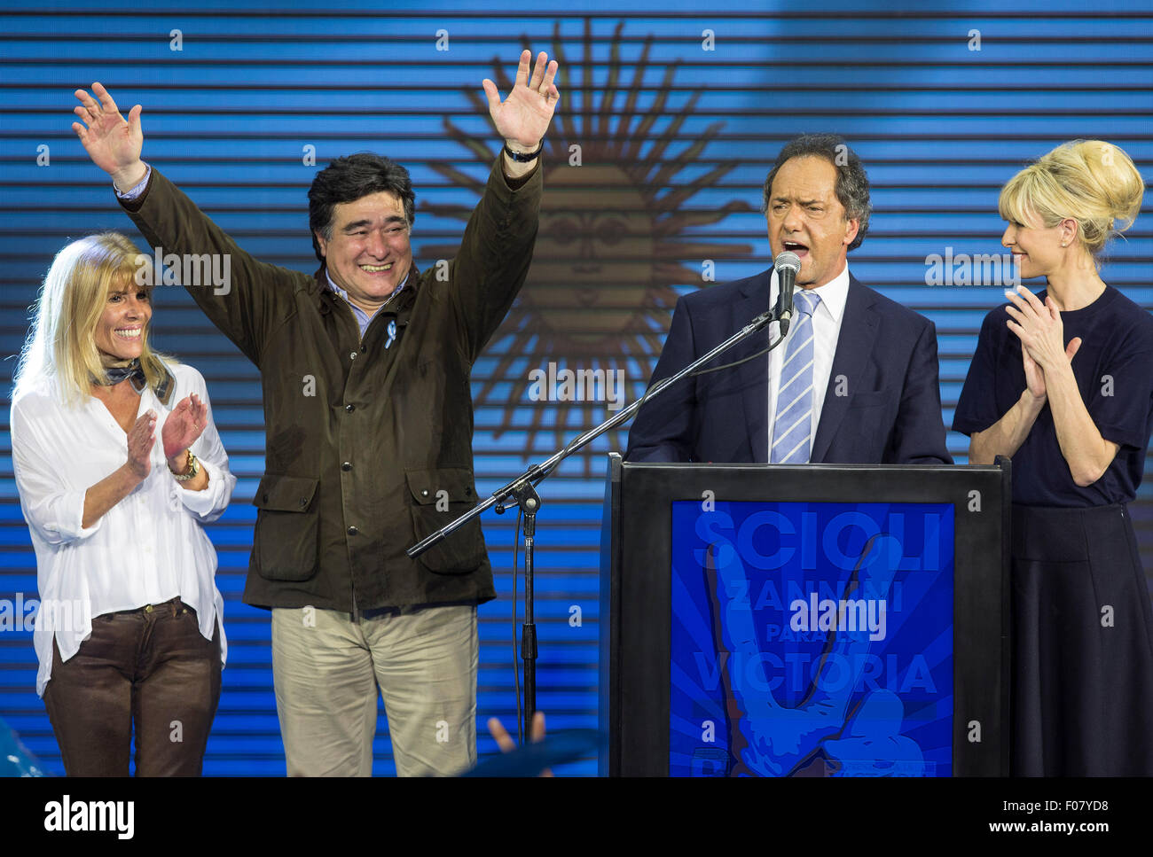 Buenos Aires, Argintina. 10th Aug, 2015. The presidential candidate to Argentina's Presidency of ruling party 'Frente para la Victoria' (Front for Victory), Daniel Scioli (2nd R), speaks along with his wife Karina Rabolini (R), vice-presidential candidate Carlos Zanini (2nd L), and his wife Patricia Alzua (L), at the campaign bunker, in Buenos Aires city, Argentina, early August 10, 2015. Scioli received most votes in the national primary elections in Buenos Aires on Sunday, ahead the general elections to be held on October 25th. Credit:  Xinhua/Alamy Live News Stock Photo