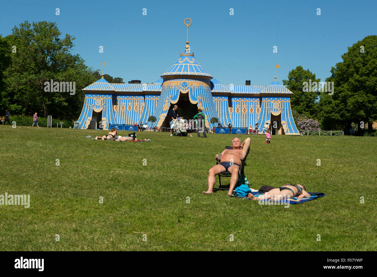 People sunbathing at the Copper Tent at the Haga Park. Stock Photo