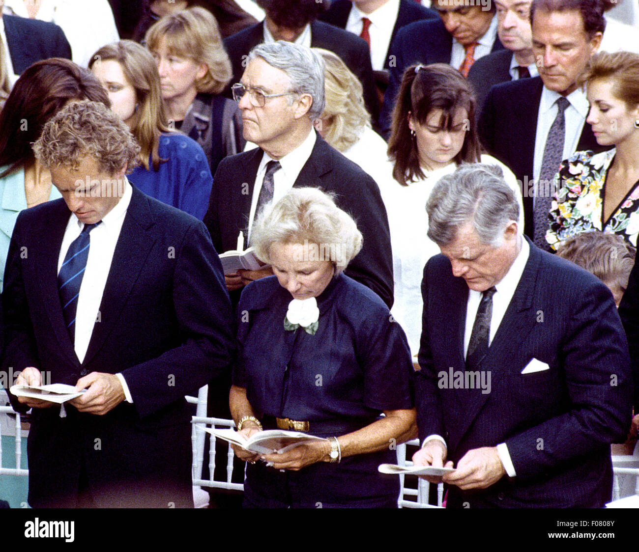 USA. 9th Aug, 2015. FILE PIC: In this file photo dated June 6, 1988, United States Senator Edward M. 'Ted' Kennedy (Democrat of Massachusetts), right, attends a ceremony at Arlington National Cemetery in Arlington, Virginia remembering his slain brother, former U.S. Senator Robert F. Kennedy (Democrat of New York). Robert Kennedy's eldest son, Joseph P. Kennedy, III is at left and his wife, Ethel is at center. Also pictured is Kennedy in-law R. Sergeant Shriver (center behind Ethel Kennedy). Credit:  dpa picture alliance/Alamy Live News Stock Photo