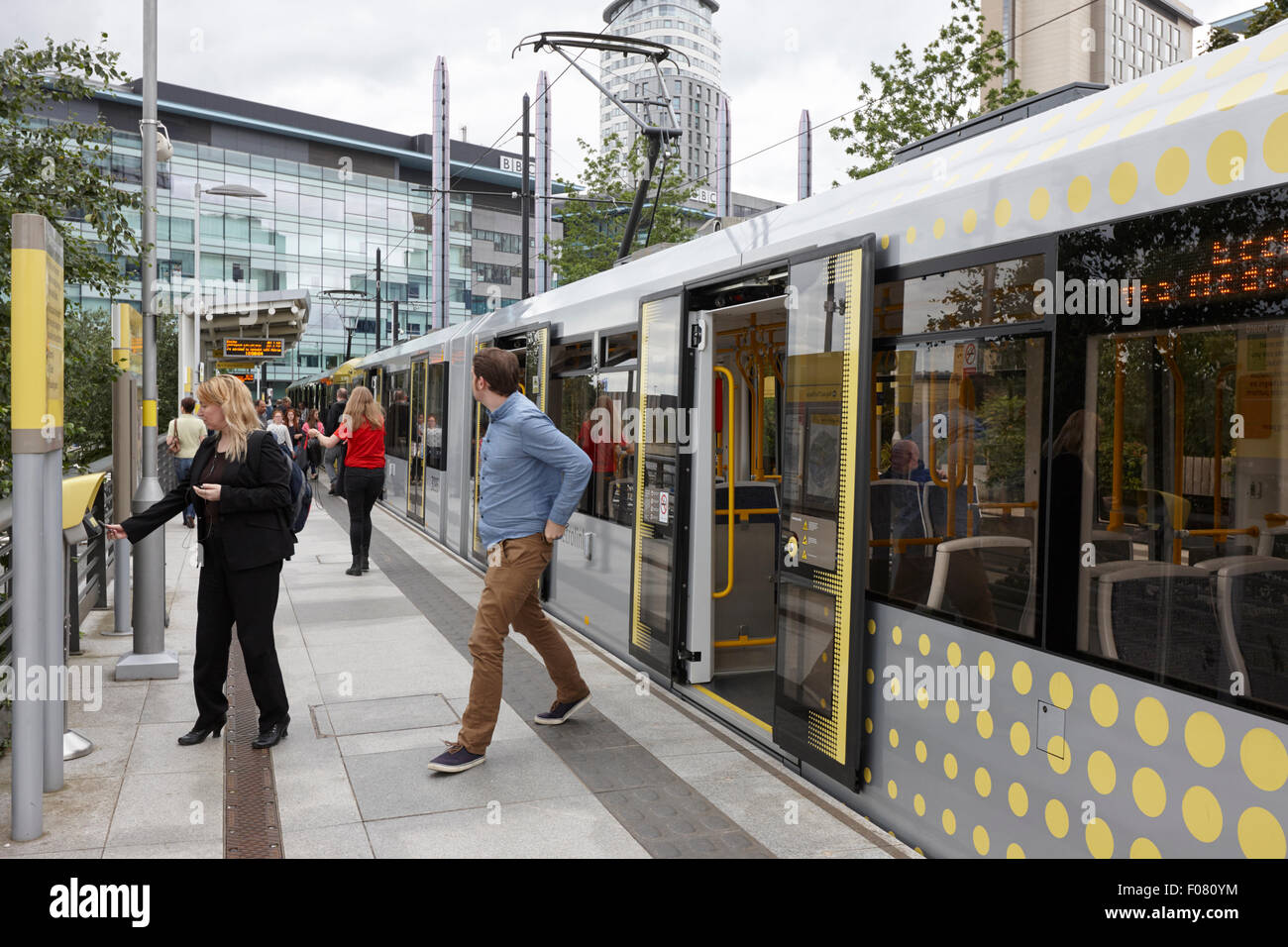 passengers and metrolink trams at mediacity station Manchester uk Stock Photo