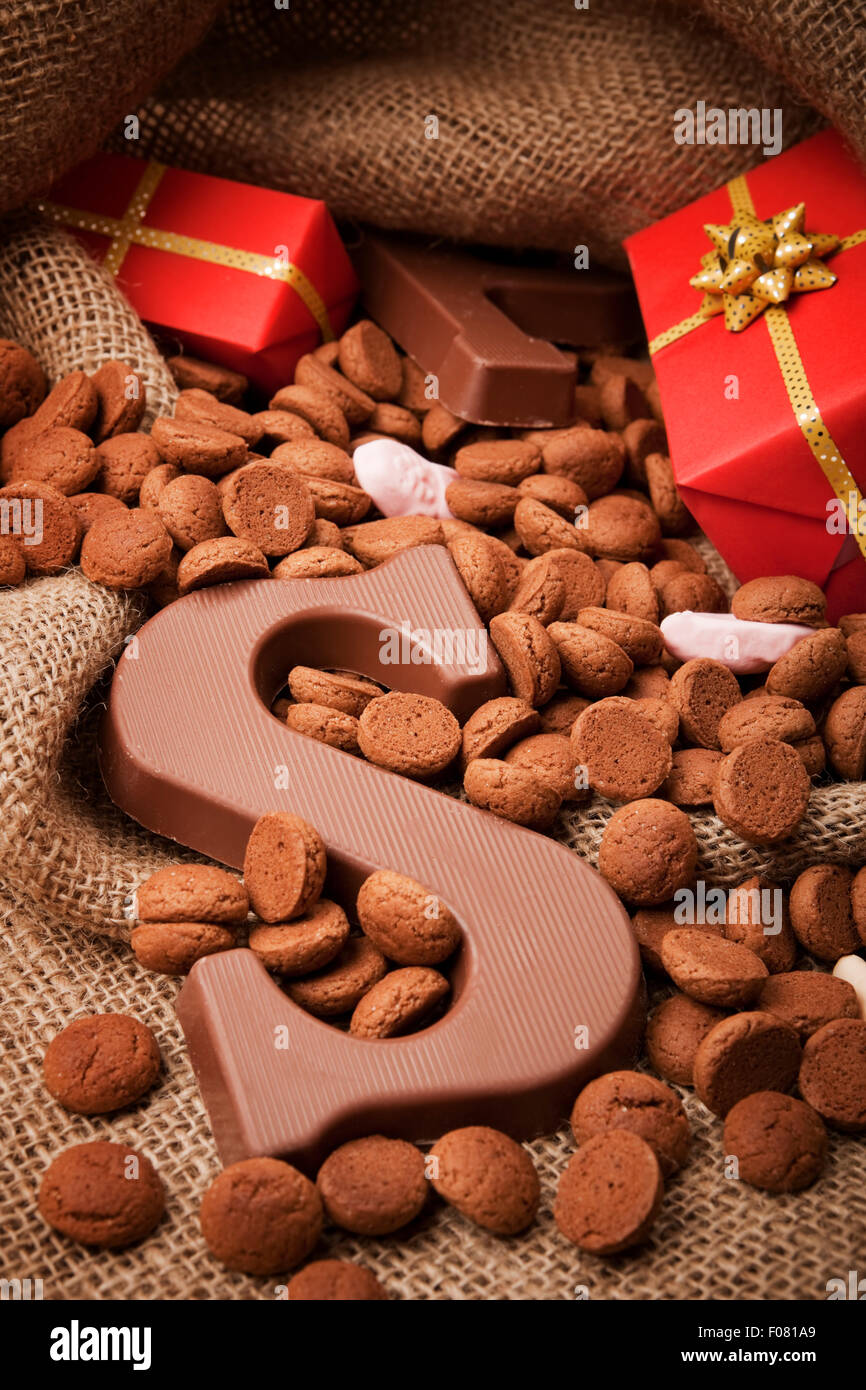'De zak van Sinterklaas' (St. Nicholas' bag) filled with 'pepernoten', a letter of chocolate and sweets. All part of the traditi Stock Photo