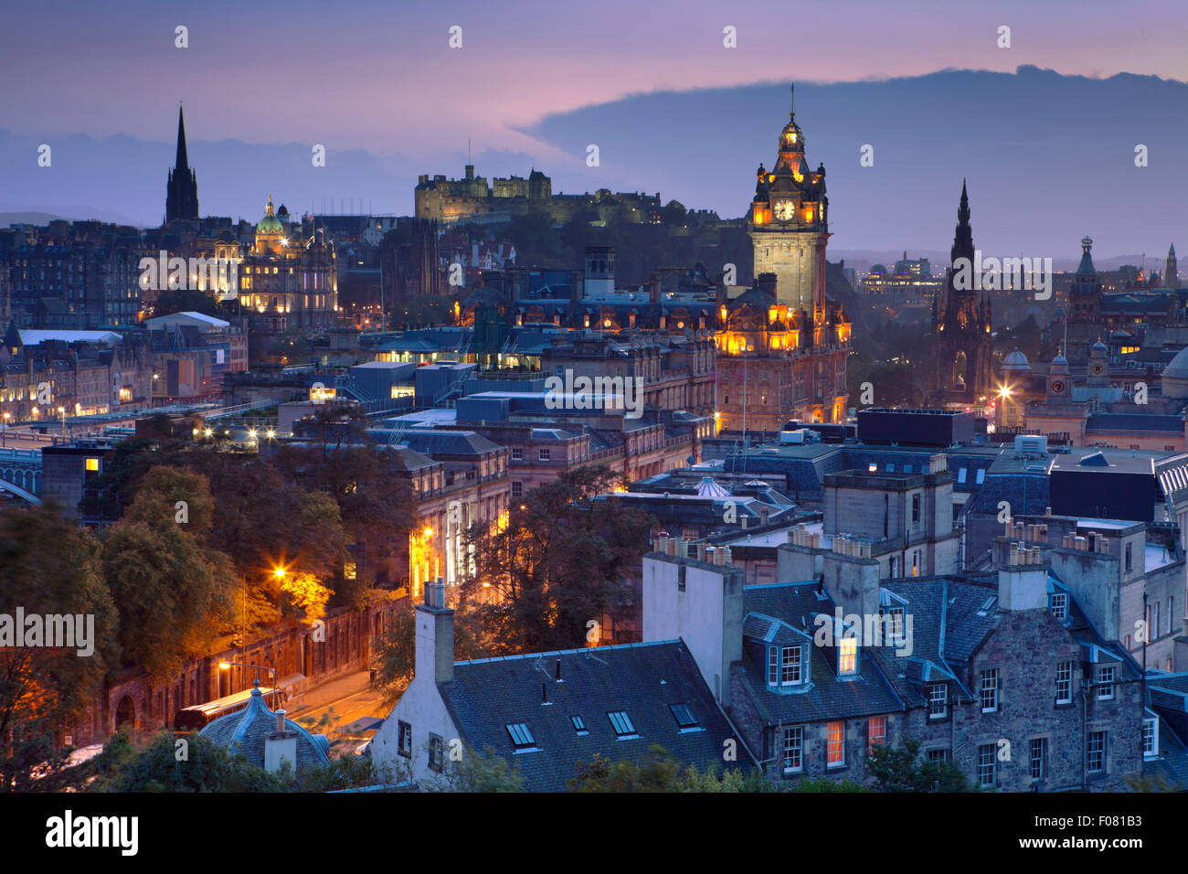 The Edinburgh skyline with the Edinburgh castle in the background. Photographed from Calton Hill just after sunset. Stock Photo