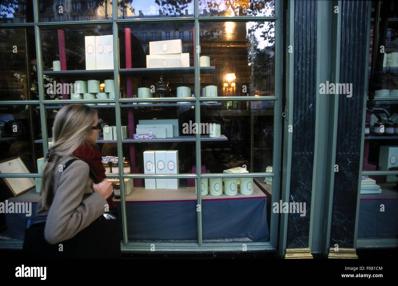 Woman entering Cafe Laduree in Paris, France Stock Photo