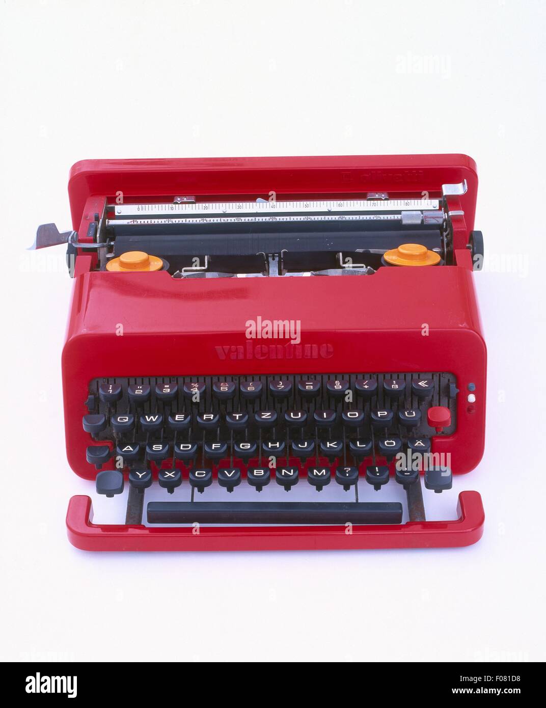 Red typewriter on white background Stock Photo - Alamy