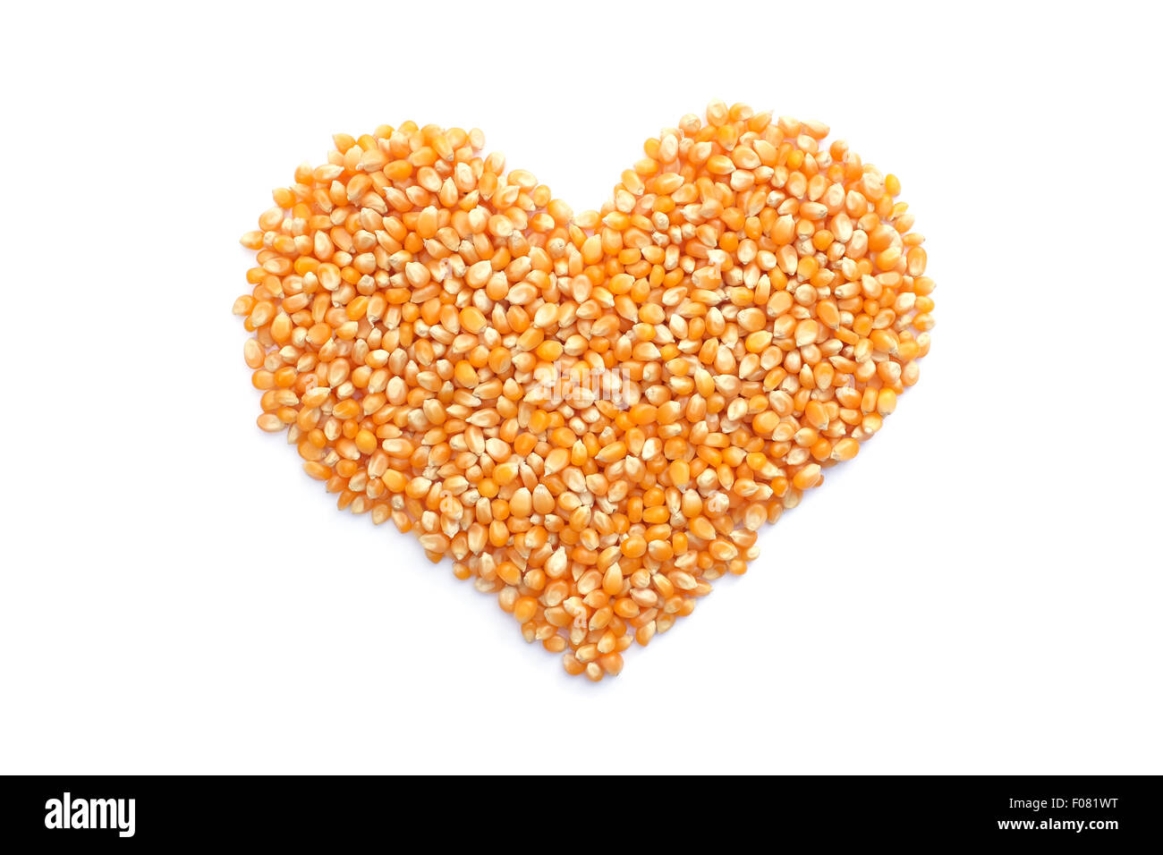 Popcorn maize in a heart shape, isolated on a white background Stock Photo