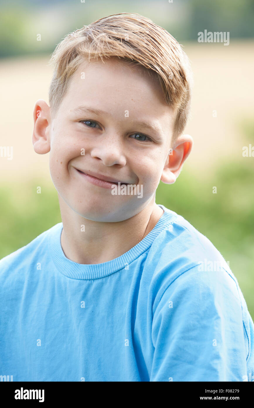Outdoor Head And Shoulder Portrait Of Smiling Boy Stock Photo