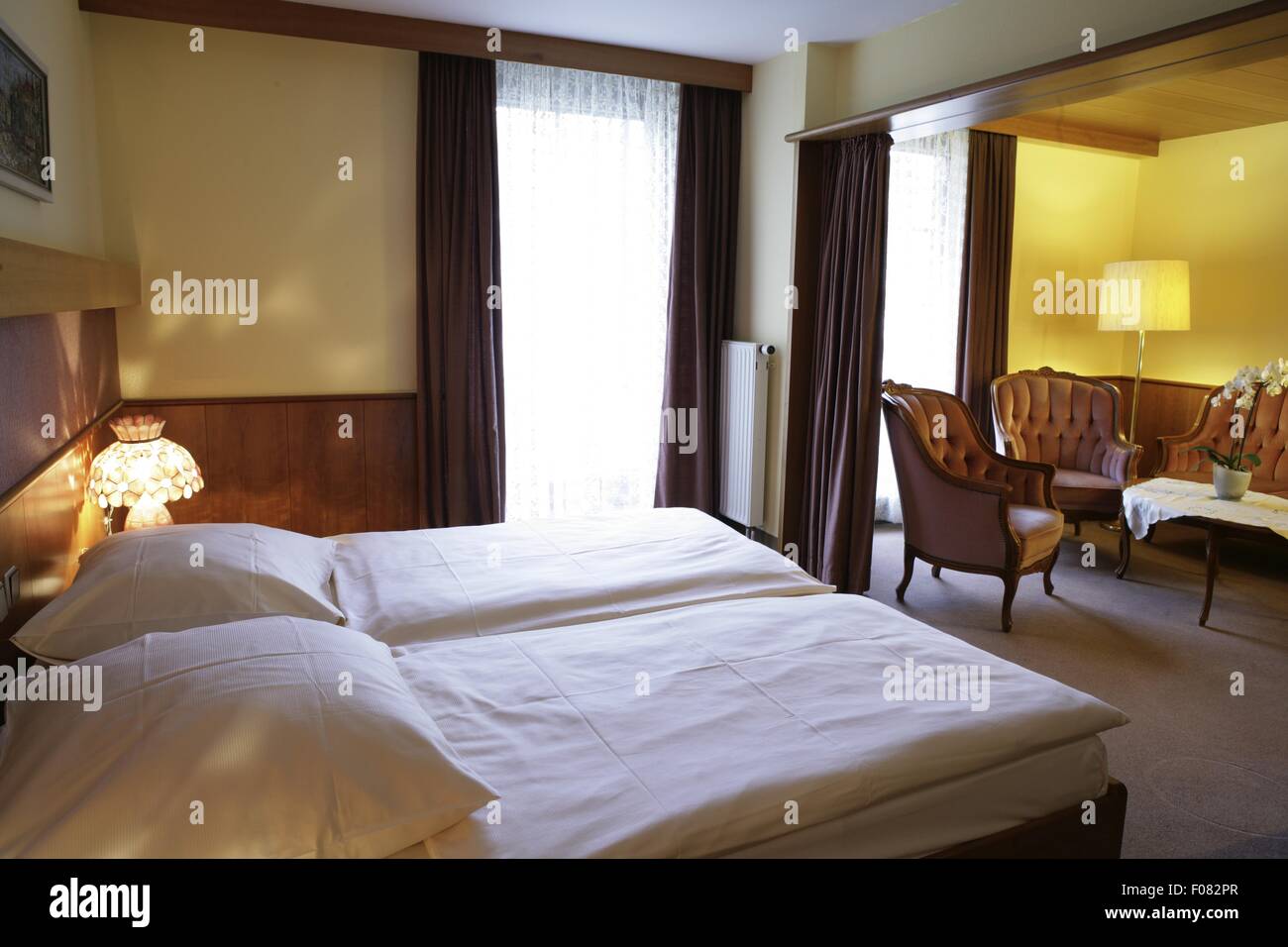 Bedroom of hotel with double bed, Germany Stock Photo Alamy
