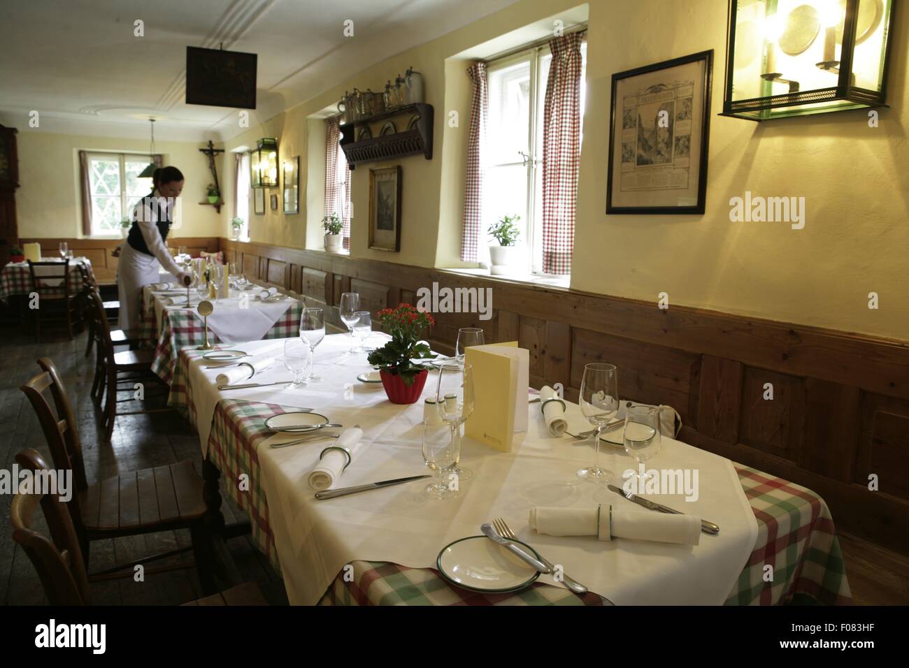 Tables laid in restaurant, Austria Stock Photo - Alamy