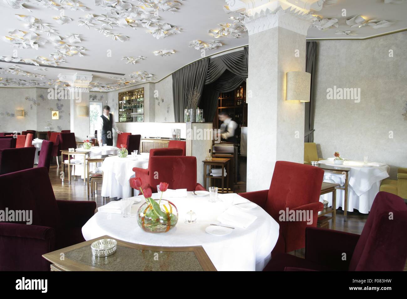 Tables laid in restaurant, Austria Stock Photo - Alamy