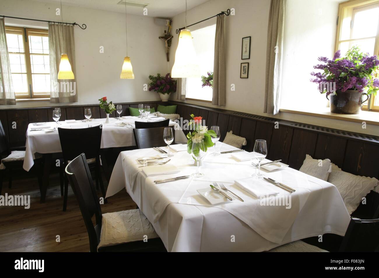 Tables laid in restaurant, Austria Stock Photo - Alamy