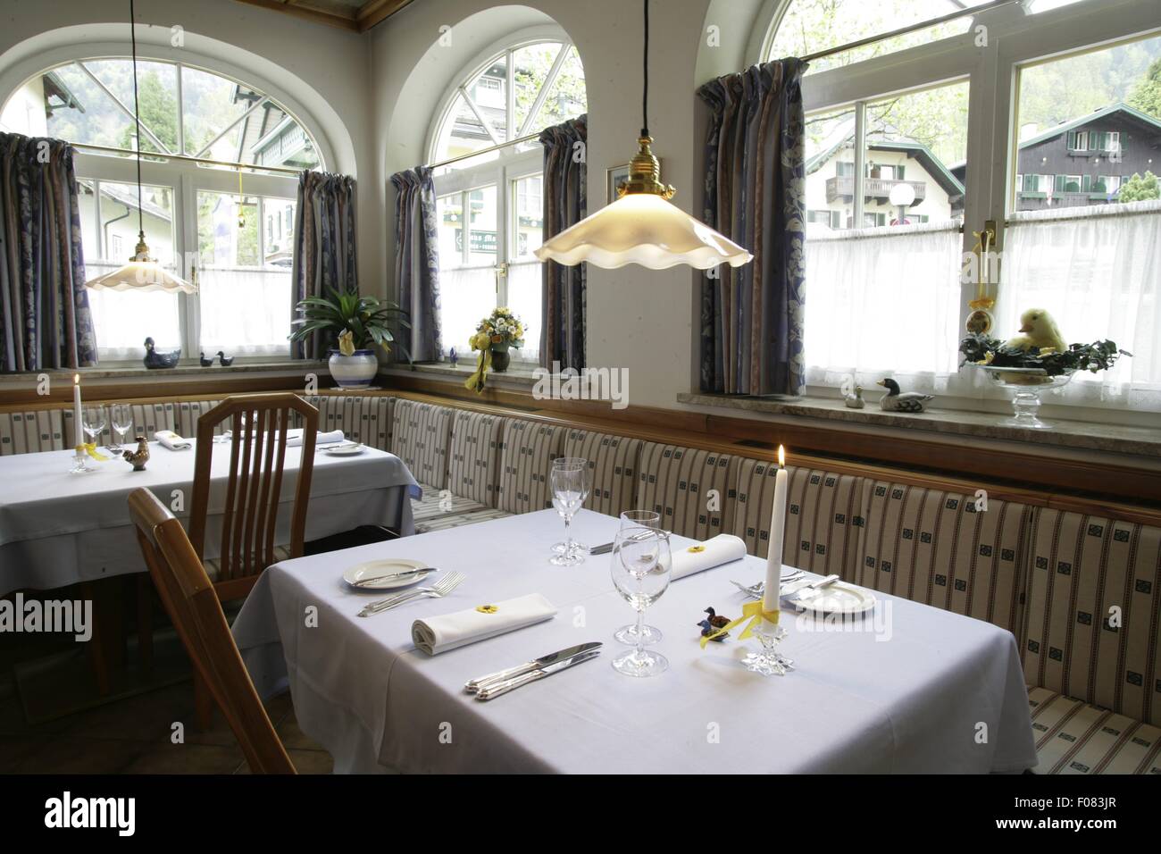 Tables laid in restaurant, Austria Stock Photo - Alamy